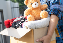 person holding a box of donations