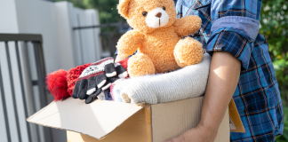 person holding a box of donations