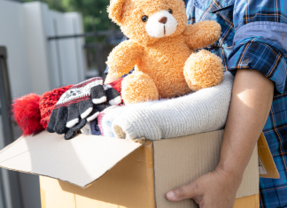 person holding a box of donations