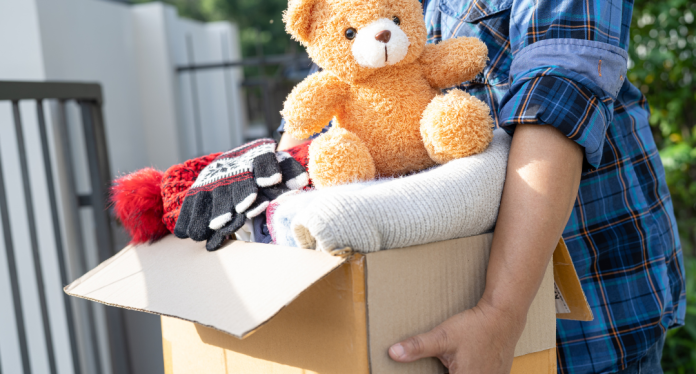 person holding a box of donations