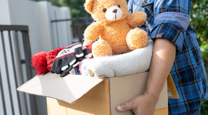 person holding a box of donations