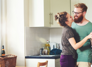 couple dancing in the kitchen