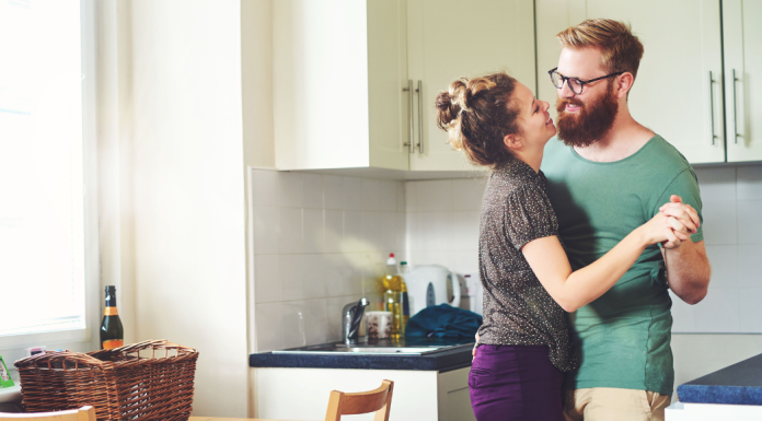 couple dancing in the kitchen