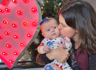 mom kissing baby