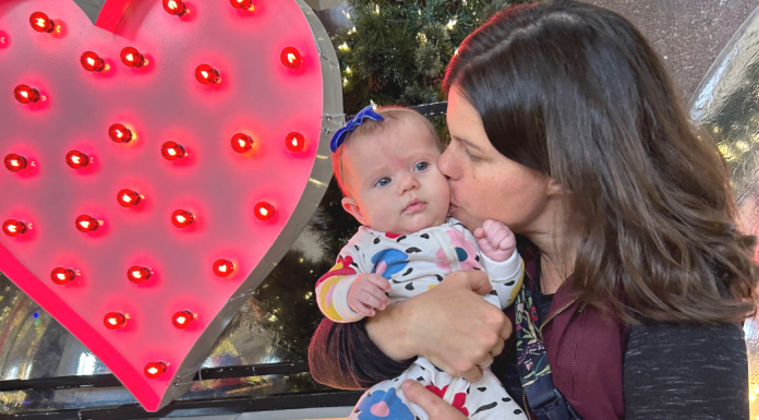 mom kissing baby