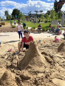 boy playing in sand