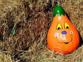 painted pumpkin in haystack