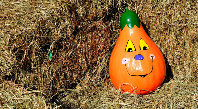 painted pumpkin in haystack