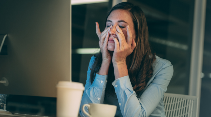 woman stressed with hands on face