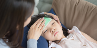 A mother caring for a sick child.