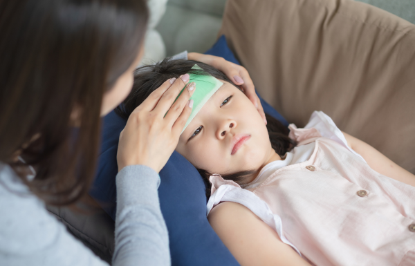 A mother caring for a sick child.