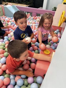 Children playing in giant ball pit at Spark the Senses indoor play space. 