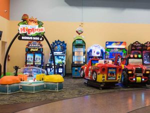 Arcade area with colorful, interactive arcade games at Candeeland Kids. 