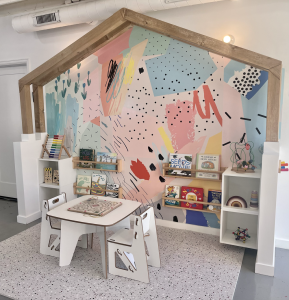 Reading nook with muted colors and engaging puzzles Tumble Haus offers unique addition to indoor play spaces. 